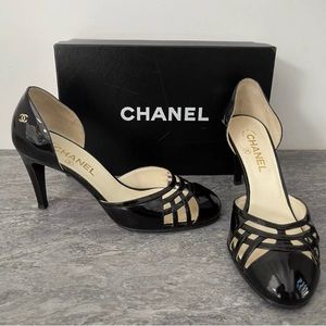 ISO Chanel black patent dorsey round toe cross strapping heels